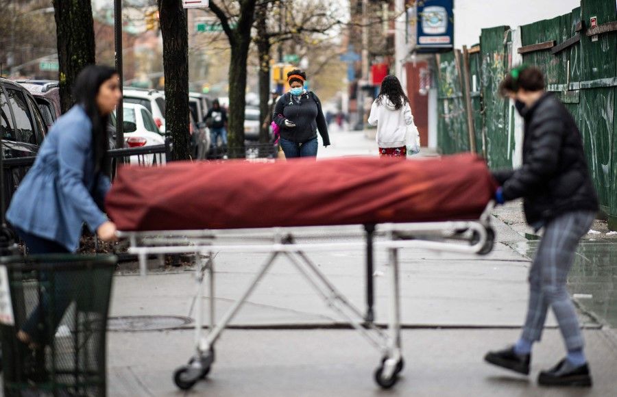 A body being transferred to a funeral home, New York City, 24 April, 2020. The US has been hit hard by the coronavirus. (Johannes Eisele/AFP)