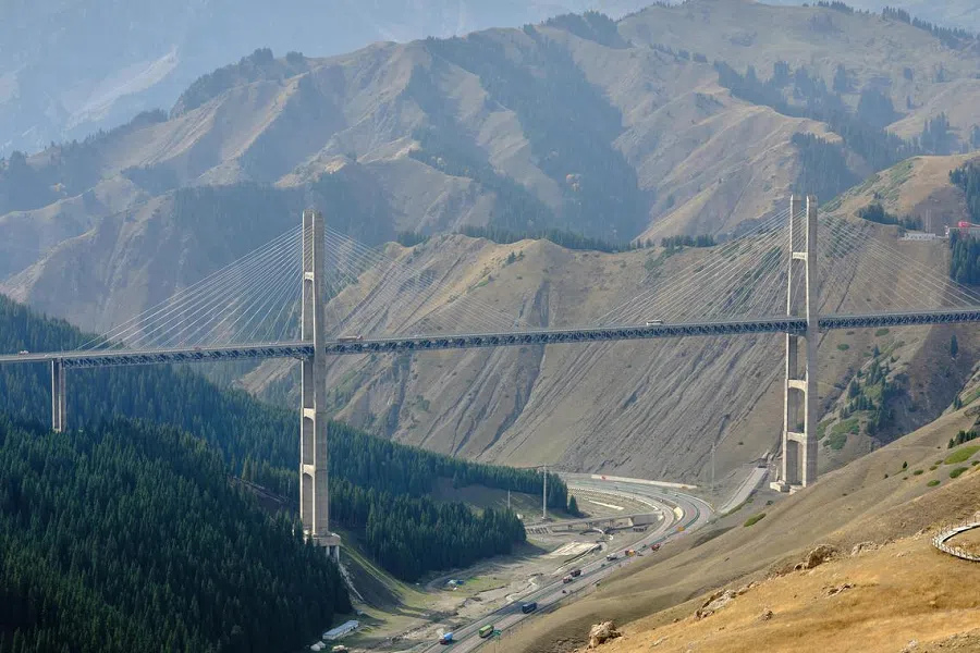 Not far from Sayram Lake, a steel dragon weaves through the majestic and imposing mountains: the Guozigou Bridge that opened in 2011. Spanning about 700 metres in length, the bridge cost a whopping 2.39 billion RMB (approximately US$326 million) to build, and is one of the most expensive bridges per unit length in China.