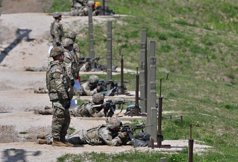 US soldiers take part in a stress shoot during the Best Squad Competition, conducted by the US 2nd Infantry Division and the ROK-US Combined Division at the US Army's Camp Casey in Dongducheon on 3 May 2023. (Jung Yeon-je/AFP)