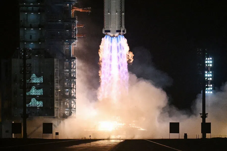 A Long March-2F carrier rocket, carrying the Shenzhou-18 spacecraft and a crew of three astronauts, lifts off from the Jiuquan Satellite Launch Centre in the Gobi desert in northwest China on 25 April 2024.  (Greg Baker/AFP)