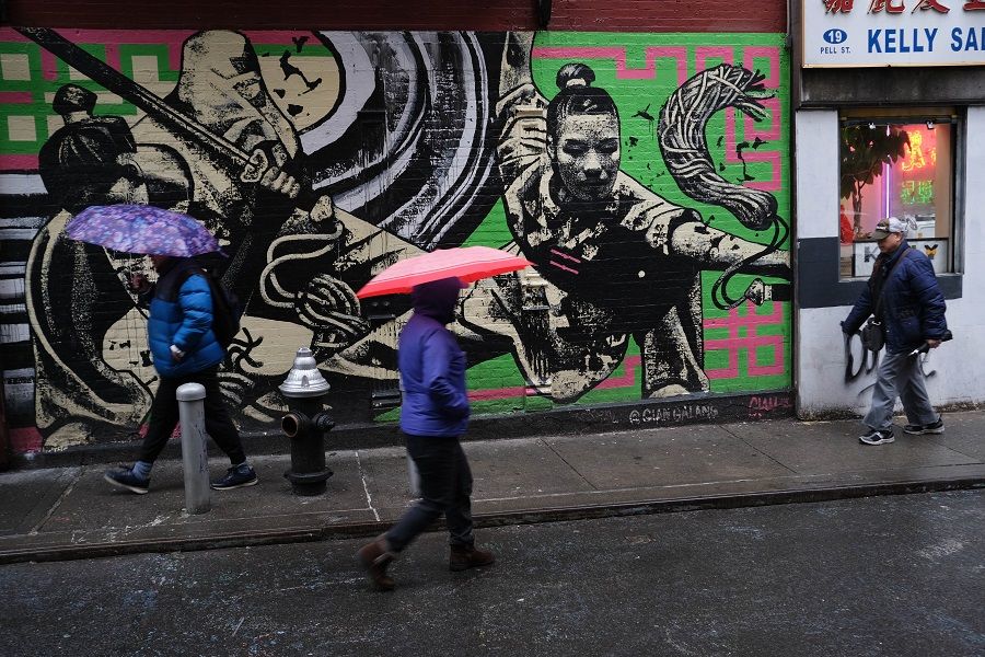 People walk through New York's Chinatown on 13 February 2020. (Spencer Platt/Getty Images/AFP)