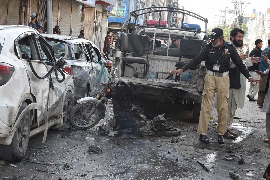 A police officer examines the site of a bomb blast in Quetta, Pakistan, on 10 April 2023. (Banaras Khan/AFP)