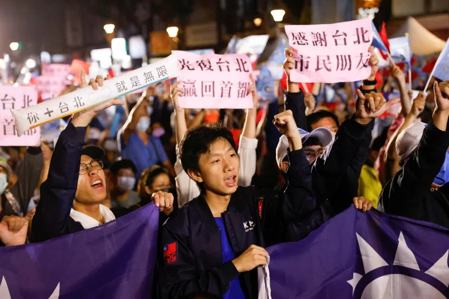 Supporters of the opposition party Kuomintang (KMT) celebrate the preliminary results of the local elections during a rally in Taipei, Taiwan, 26 November 2022. (Carlos Garcia Rawlins/Reuters)