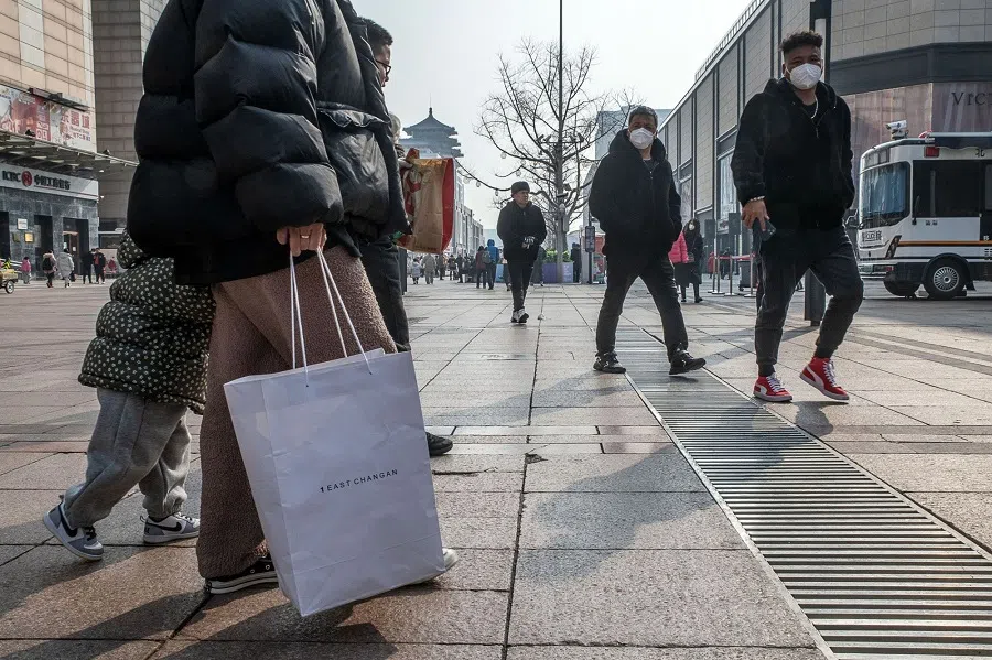 Pedestrians in the Wangfujing shopping area in Beijing, China, on 10 February 2023. (Bloomberg)