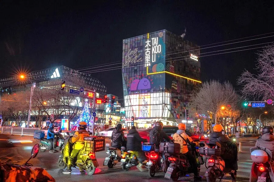 Motorists in front of Tai Koo Li shopping area in Beijing, China on 30 December 2024. (Na Bian/Bloomberg)