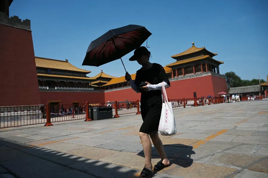 A woman visits the Forbidden City in Beijing, China, on 24 June 2023. (Greg Baker/AFP)