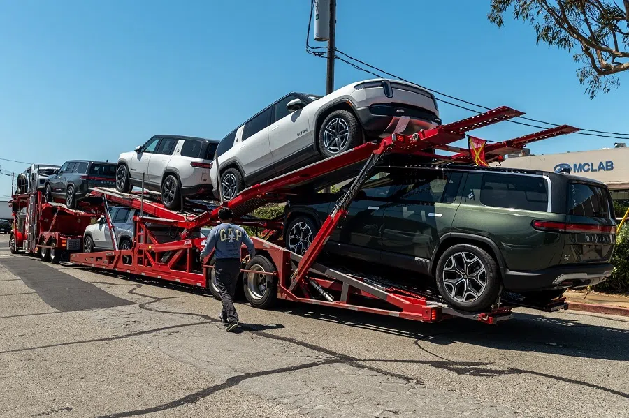 Electric vehicles on an auto transport truck at a dealership in South San Francisco, California, US, on 3 June 2025. (David Paul Morris/Bloomberg)