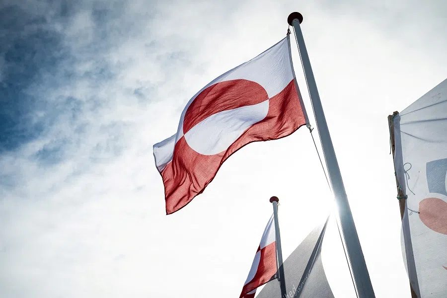 Greenland’s flag flutters at the Inussivik hall in Nuuk, Greenland, on 6 April 2021. (Emil Helms/Ritzau Scanpix via Reuters)