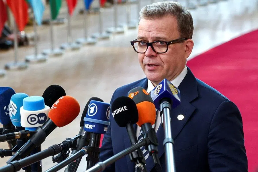 Finnish Prime Minister Petteri Orpo speaks to the press upon his arrival for a European Union leaders' summit in Brussels, Belgium, on 19 March 2026. (Yves Herman/Reuters)
