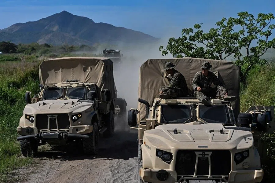 US soldiers rest on top of a Joint Light Tactical Vehicle (JLTV) in the Integrated Air and Missile Defense (IAMD) demonstration during Balikatan, the annual joint military exercises between the US and the Philippines, at Naval Station Leovigildo Gantioqui, San Antonio, Zambales, Philippines, on 28 April 2026.