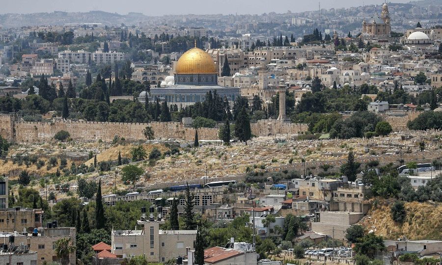 This picture taken on 3 June 2020 shows a view of the Palestinian neighbourhood of Wadi al-Joz (below) in occupied east Jerusalem, with a backdrop of the Dome of the Rock Mosque in Jerusalem's old city. (Ahmad Gharabli/AFP)