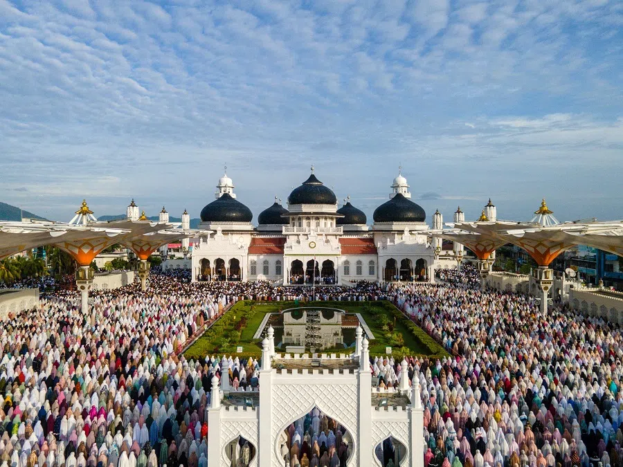 This aerial picture shows Muslim worshippers offering Eid al-Adha special prayers at the Baiturrahman grand mosque in Banda Aceh on 6 June 2025. (Chaideer Mahyuddin/AFP)