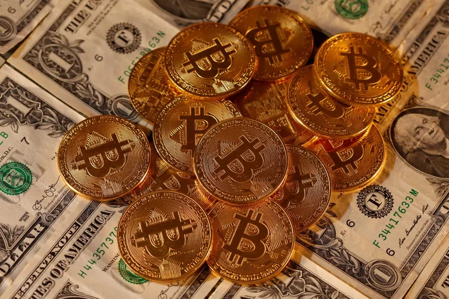 Representations of virtual currency Bitcoin and U.S. dollar banknotes are seen in this picture illustration taken January 27, 2020. (Dado Ruvic/REUTERS)