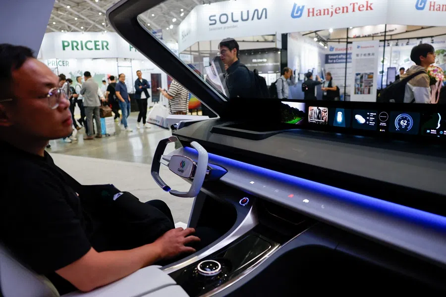 A person looks at an automotive display at a booth belonging to InnoLux Corporation at Touch Taiwan, an annual display exhibition in Taipei, Taiwan, on 16 April 2025. (Ann Wang/Reuters)