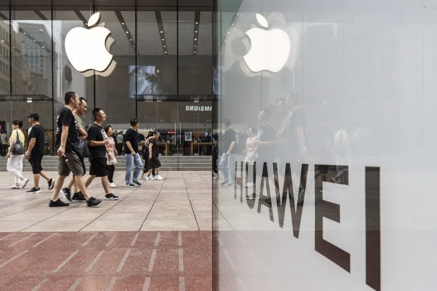 An advertisement for Huawei Technologies Co. across from an Apple Inc. store in Shanghai, China, on 10 September 2024. (Qilai Shen/Bloomberg)