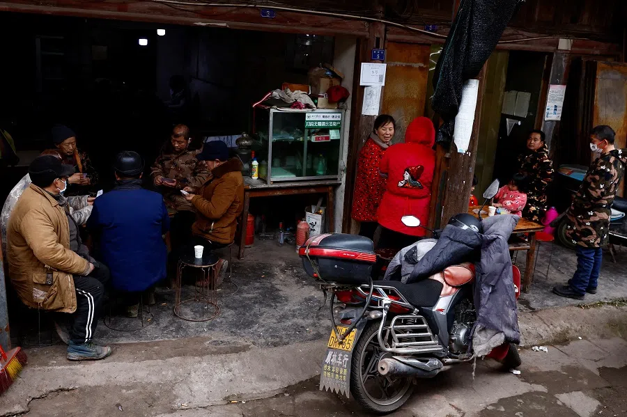 Villagers play mahjong in Lezhi county in Ziyang, Sichuan province, China, 29 December 2022. (Tingshu Wang/Reuters)