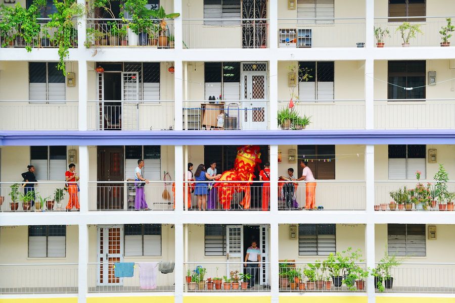 Overseas Chinese start to see themselves as Chinese overseas; their national identity is no longer tied to China, but to their naturalised countries. This photo shows a lion dance troupe performing at an HDB block during Chinese New Year. It demonstrates a uniquely Singaporean Chinese identity. (Photo: Hang Loo Ming)
