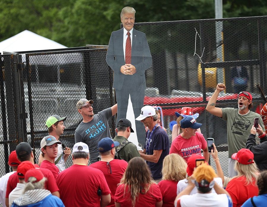 Supporters of US President Donald Trump gather to attend a campaign rally at the BOK Center, on 20 June 2020 in Tulsa, Oklahoma. (Win McNamee/Getty Images/AFP)