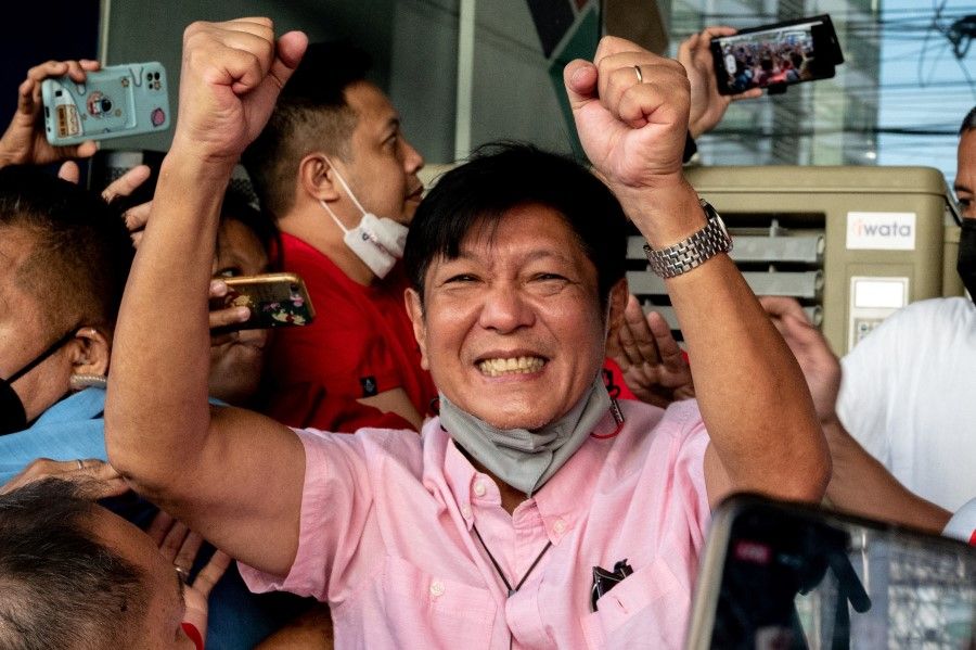 Philippine president-elect Ferdinand "Bongbong" Marcos Jr., son of late dictator Ferdinand Marcos, greets his supporters at his headquarters in Mandaluyong City, Metro Manila, Philippines, 11 May 2022. (Lisa Marie David/Reuters)