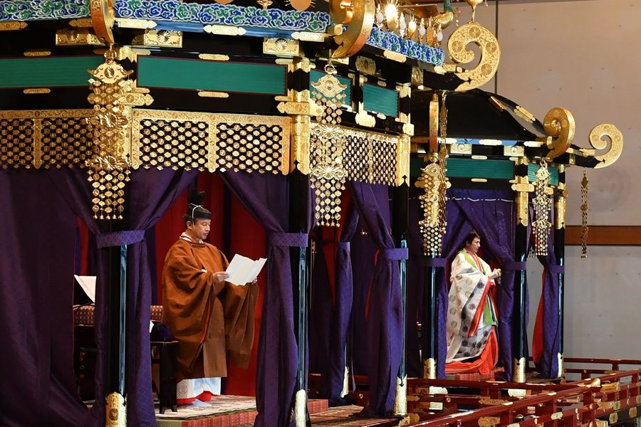 Emperor Naruhito (left) and Empress Masako (right) attend the enthronement ceremony where the emperor officially proclaims his ascension to the Chrysanthemum Throne at the Imperial Palace in Tokyo on October 22, 2019. (Kazuhiro Nogi/POOL/AFP)