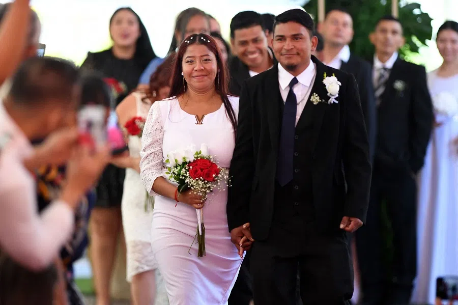 A couple participates in a collective wedding ceremony known as “Good Heart Weddings” as part of the Month of Love and Friendship in Tegucigalpa on 25 February 2025. (Orlando Sierra/AFP)