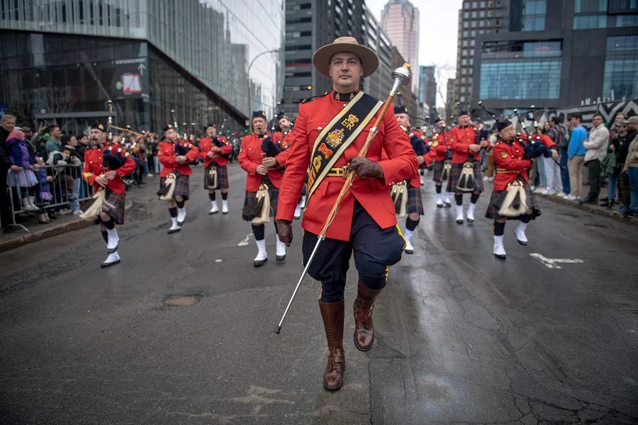 People participate in Montreal’s Saint Patrick’s Day Parade in Montreal, Canada, on 16 March 2025. Montreal’s parade, the oldest in Canada, is celebrating its 200th year. (Andrej Ivanov/AFP)