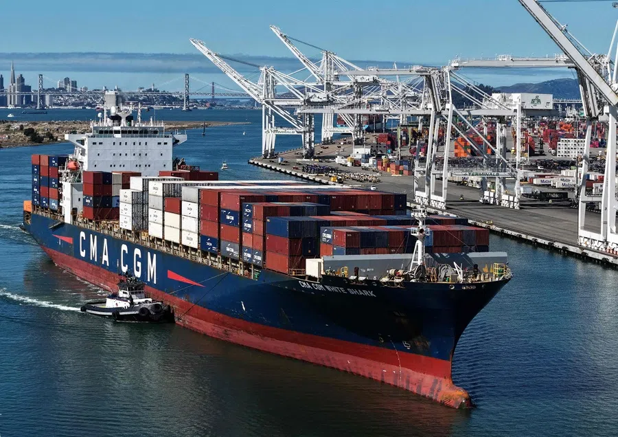 In an aerial view, a container ship arrives at the Port of Oakland on 10 October 2025 in Oakland, California. (Justin Sullivan/Getty Images/AFP)