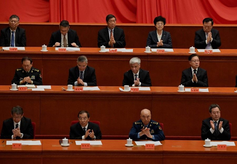 Delegates applaud during the commemoration of the 110th anniversary of the Xinhai Revolution, at the Great Hall of the People in Beijing on 9 October 2021. (Noel Celis/AFP)