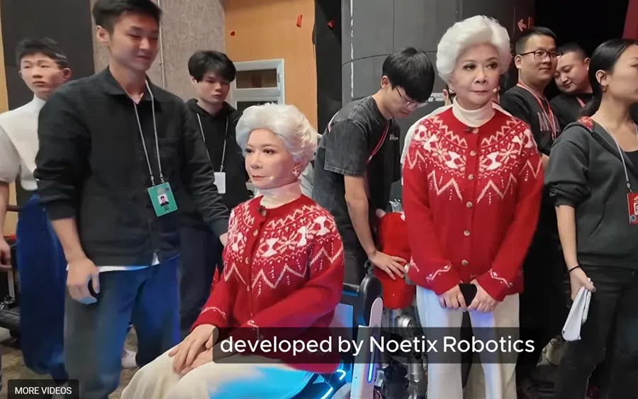 Actress Cai Ming beside a replica humanoid robot of her, pictured at CCTV’s 2026 Spring Festival Gala.