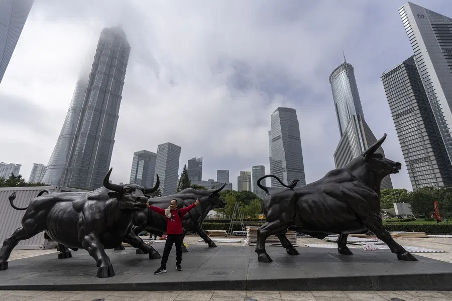 Statues of bulls in Pudong’s Lujiazui Financial District in Shanghai, China, on 21 October 2024. China’s domestic yuan traders appear to be more confident than their offshore counterparts that the currency’s turbulence will be contained around the US presidential election period. (Qilai Shen/Bloomberg)