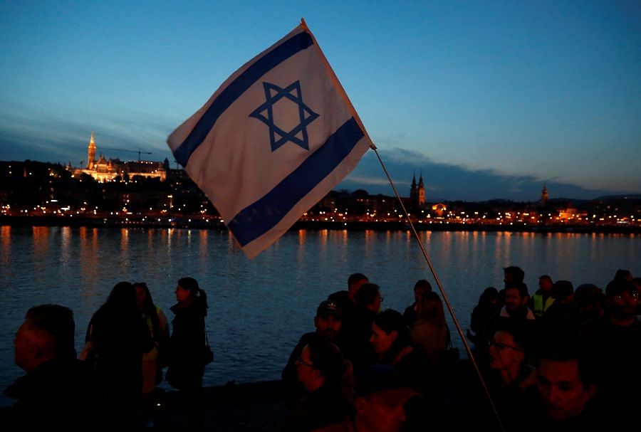 Pro-Israel protesters gather at the "Shoes on the Danube Bank" memorial, during the ongoing conflict between Israel and the Palestinian Islamist group Hamas, in Budapest, Hungary, on 10 October 2023. (Bernadett Szabo/Reuters)