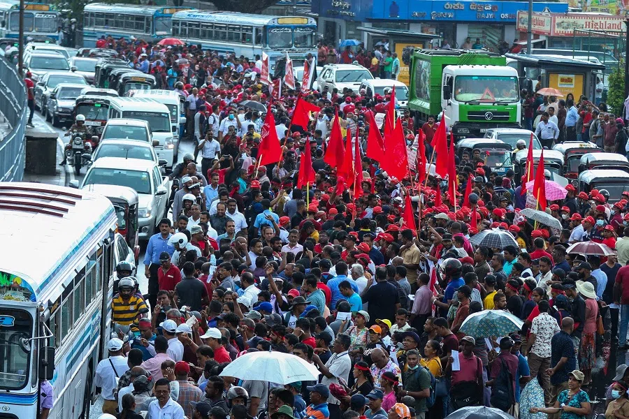 Trade union members protest over the government's debt restructuring affecting the income of the pension funds, in Colombo, Sri Lanka, on 25 July 2023. (AFP)