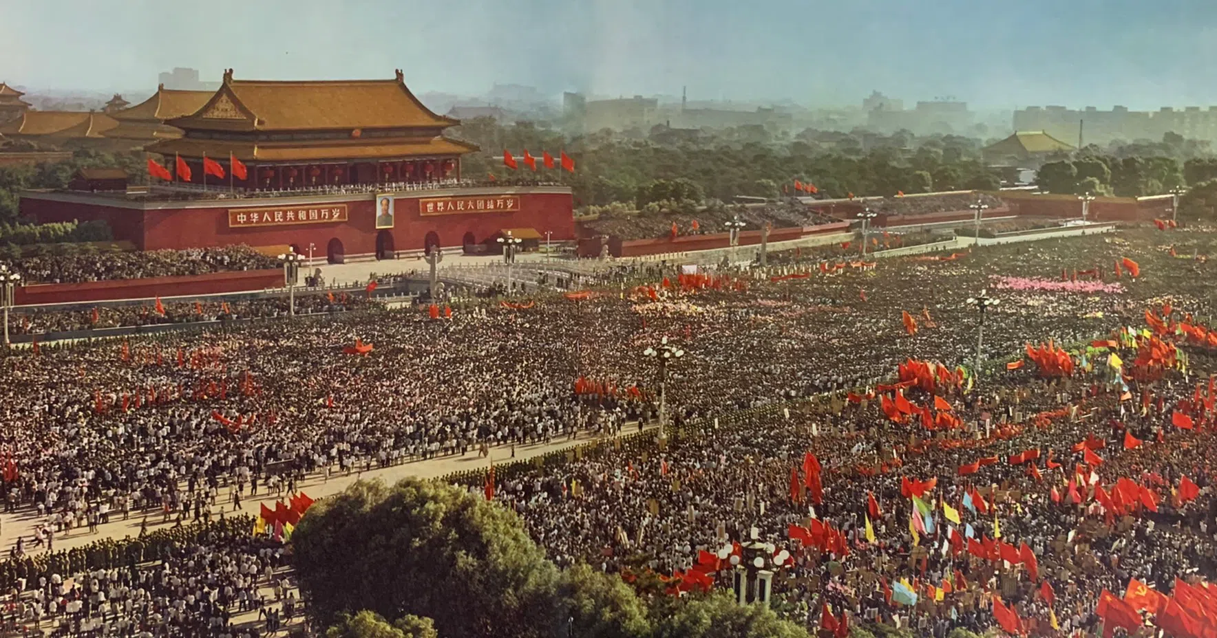 A massive crowd with red flags flying in Tiananmen Square, 1966.