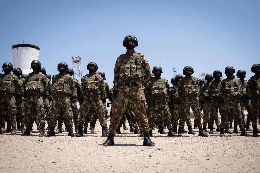 Mozambican soldiers stand as Mozambican President Filipe Nyusi and Rwanda President Paul Kagame review the troops on 24 September 2021 in Pemba, Cabo Delgado province, Mozambique, where Rwandan and Mozambican soldiers are deployed. (Simon Wohlfahrt/AFP)
