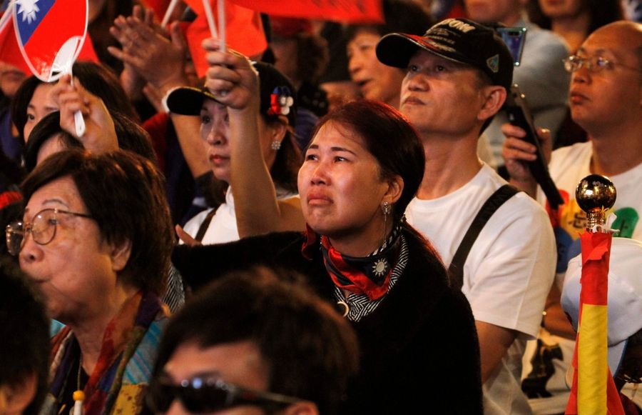 Supporters of Han Kuo-Yu, presidential candidate for Taiwan's main opposition Kuomintang (KMT) party, react as he conceded defeat in the presidential polls during a rally outside the party headquarters in Kaohsiung on 11 January 2020. (Hsu Tsun-hsu/AFP)