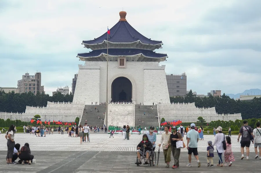 People walk at the Chiang Kai-shek Memorial Hall in Taipei on 10 October 2024.