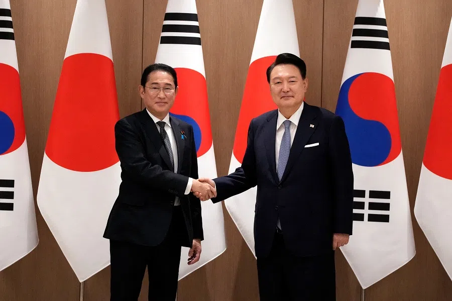 South Korea’s President Yoon Suk Yeol (right) and Japan’s Prime Minister Fumio Kishida shake hands during a meeting at the presidential office in Seoul on 6 September 2024. (Lee Jin-man/AFP)