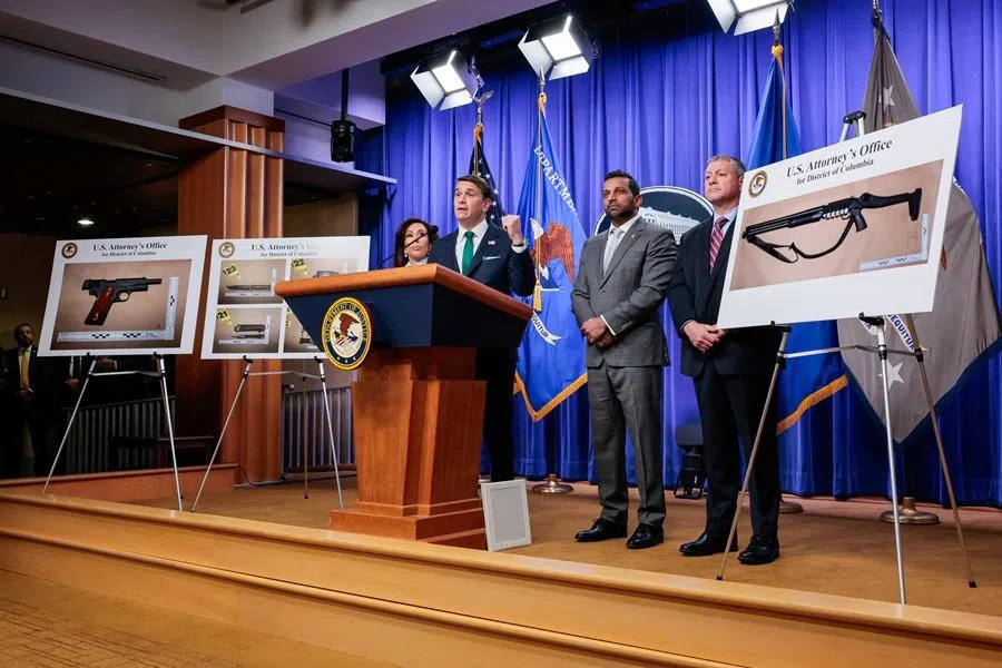 Pictures of the weapons carried by Cole Tomas Allen, the suspect in the shooting incident in Washington at the annual White House Correspondents' Association Dinner, are displayed at a press conference at the US Department of Justice about the shooting incident, in Washington, DC, US, 27 April 2026. (Kylie Cooper/Reuters)