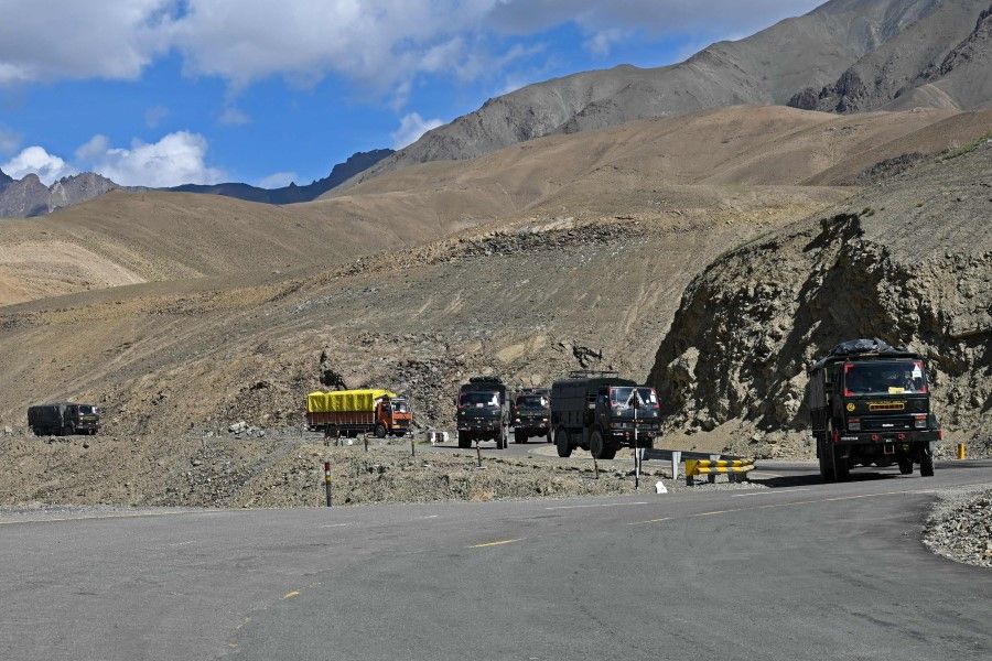 A military convoy drives towards Leh along the Srinagar-Leh Highway, part of a disputed border between China and India, on 29 June 2020. (Tauseef Mustafa/AFP)