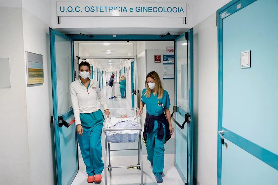 A newborn baby is transported along a corridor of Rome's Santo Spirito Hospital, Italy, on 14 November 2022. (Remo Casilli/Reuters)