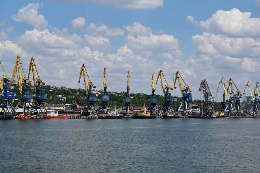 This photograph taken on 12 June 2022 shows cranes at the seaport of Mariupol, amid the ongoing Russian military action in Ukraine. (Yuri Kadobnov/AFP)