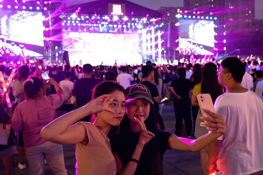 People pose during the Rock Home Town festival in Shijiazhuang, China on 4 September 2023. (Andrea Verdelli/Bloomberg)