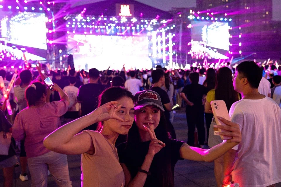 People pose during the Rock Home Town festival in Shijiazhuang, China on 4 September 2023. (Andrea Verdelli/Bloomberg)