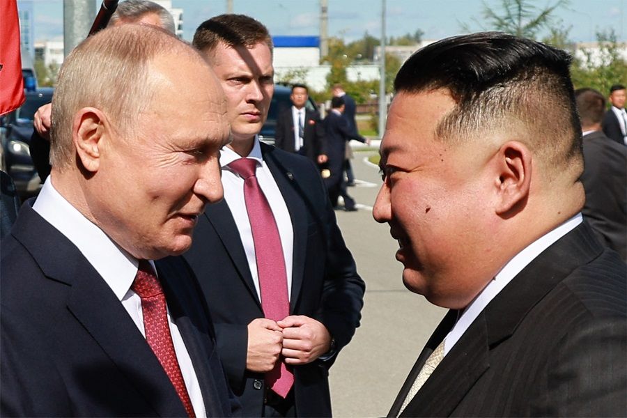 In this pool photo distributed by Sputnik agency, Russia's President Vladimir Putin (left) shakes hands with North Korea's leader Kim Jong-un during their meeting at the Vostochny Cosmodrome in Russia on 13 September 2023. (Vladimir Smirnov/Pool/AFP)