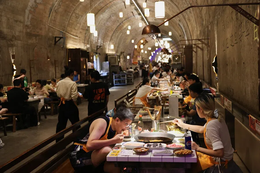 People dine at a restaurant in Chongqing, China, on 31 July 2025.