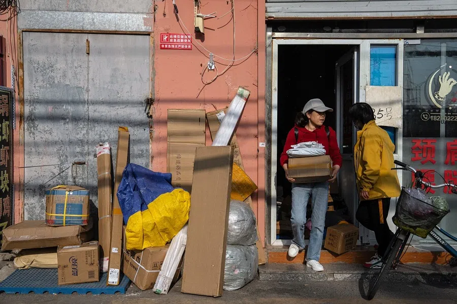 Packages outside at a neighbourhood sorting centre in Beijing, China, on 28 April 2025. (Na Bian/Bloomberg)