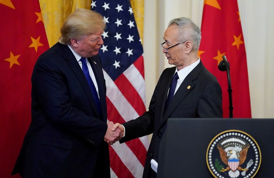 US President Donald Trump shakes hands with Chinese Vice Premier Liu He during a signing ceremony for "phase one" of the US-China trade agreement in the East Room of the White House in Washington, US, 15 January 2020. (Kevin Lamarque/File Photo/Reuters)