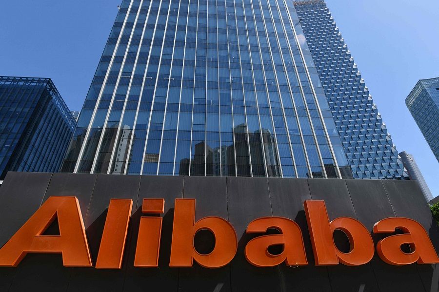 An Alibaba sign is seen outside the company's office in Beijing, China, on 13 April 2021. (Greg Baker/AFP)