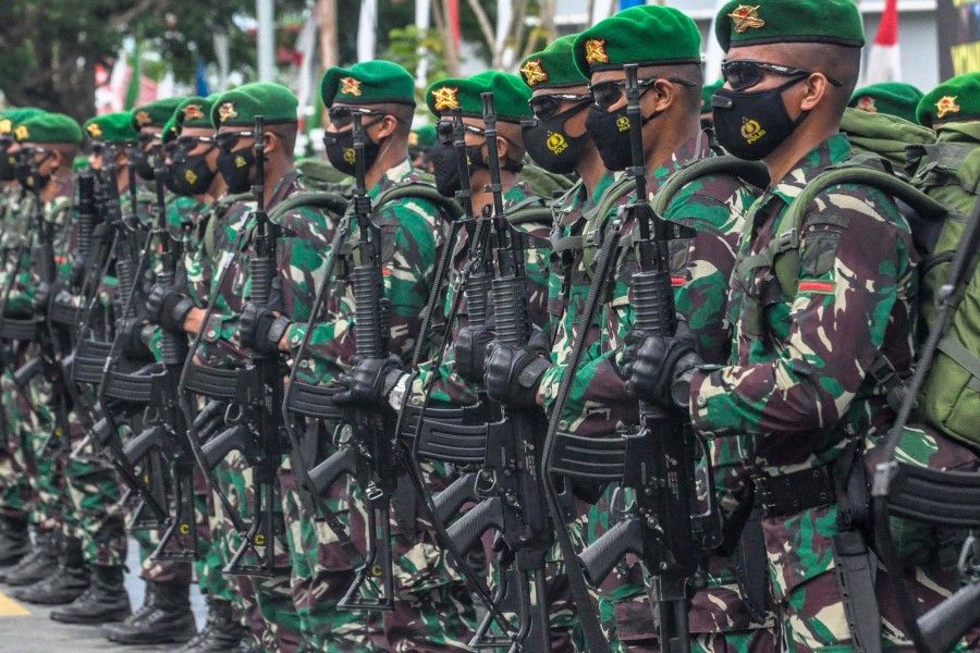 Indonesian soldiers stand in formation during a sending-off ceremony ahead of their 450-member strong assignment to the Indonesia-Papua New Guinea border, at a naval base in Palu on 9 November 2021. (Muhammad Rifki/AFP)
