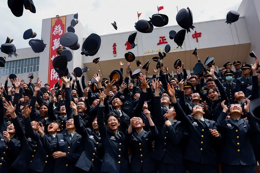 Cadets pose for group photos at the graduation ceremony of their military academies in Taipei, Taiwan, on 27 June 2024. (Ann Wang/Reuters)